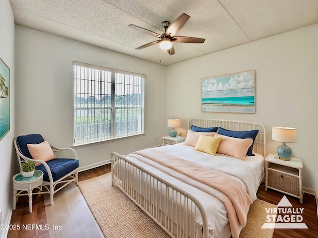 bedroom with hardwood / wood-style flooring and ceiling fan