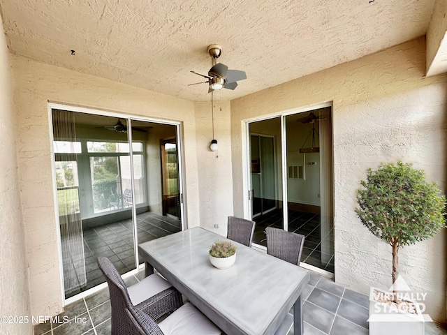 view of patio with ceiling fan