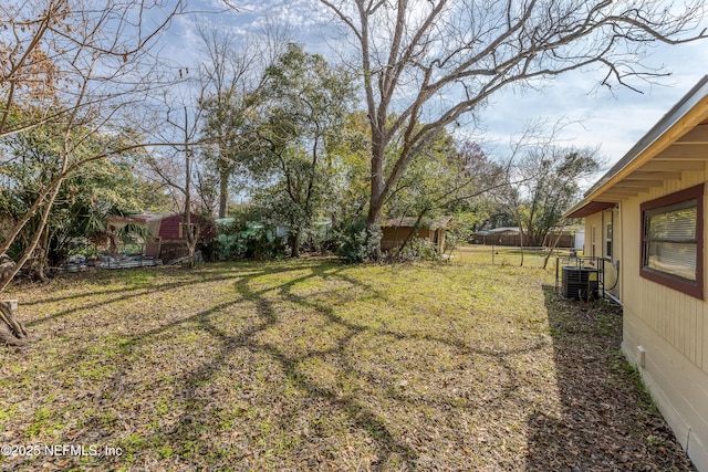 view of yard with central AC