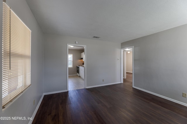 empty room featuring dark hardwood / wood-style floors