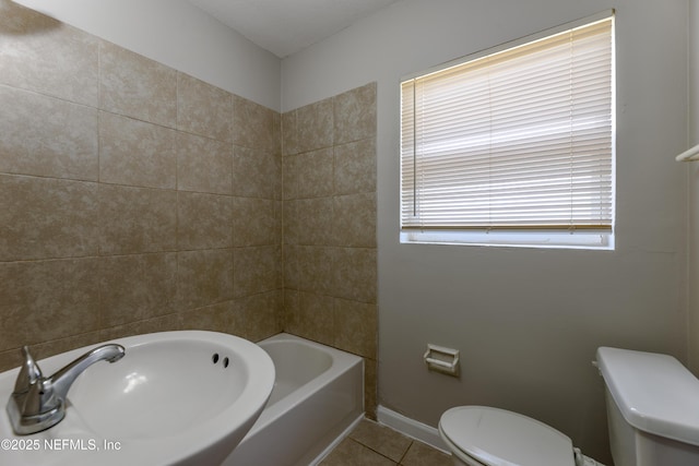 bathroom featuring sink, tile patterned floors, and toilet