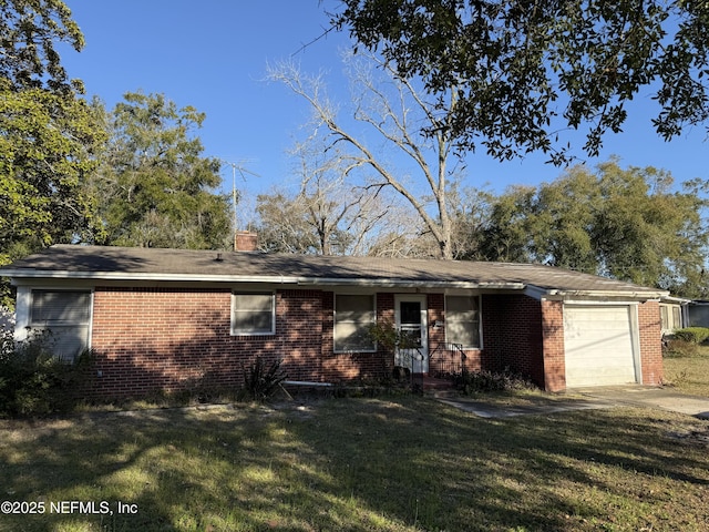 view of front facade with a garage and a front yard