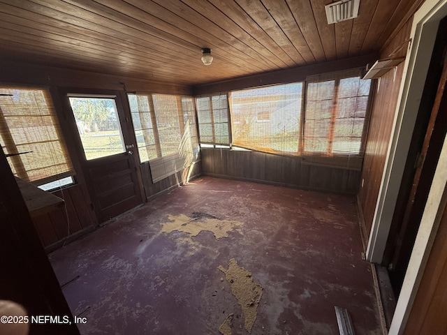 unfurnished sunroom with wooden ceiling