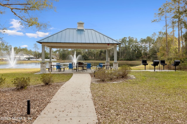 view of home's community featuring a water view, a yard, and a gazebo