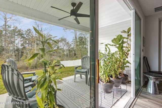 entryway featuring wood-type flooring and ceiling fan