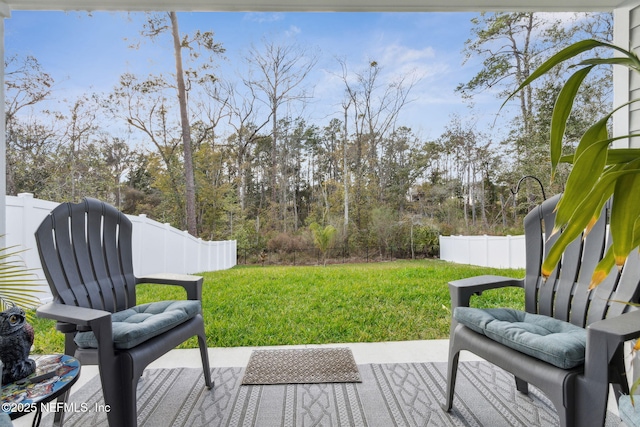 wooden terrace featuring a lawn