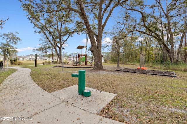 surrounding community with a playground and a lawn