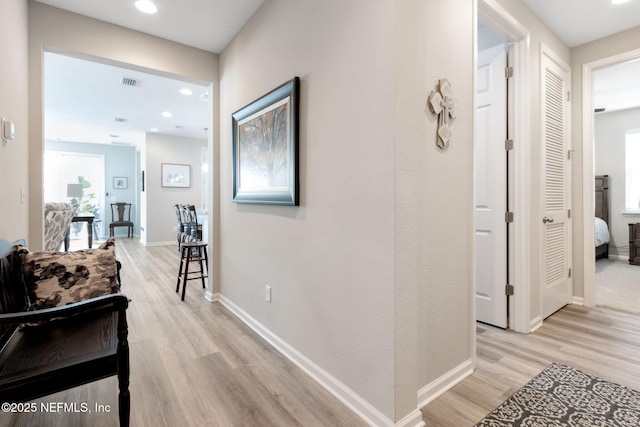 hallway featuring light hardwood / wood-style flooring