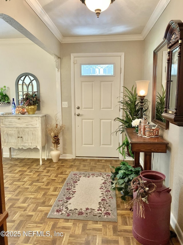 entrance foyer with light parquet floors and ornamental molding