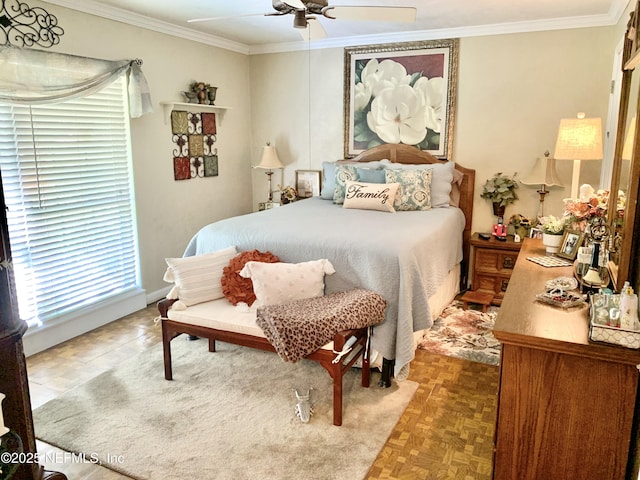 bedroom with crown molding, parquet flooring, and ceiling fan