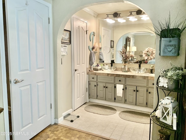 bathroom with vanity and parquet flooring