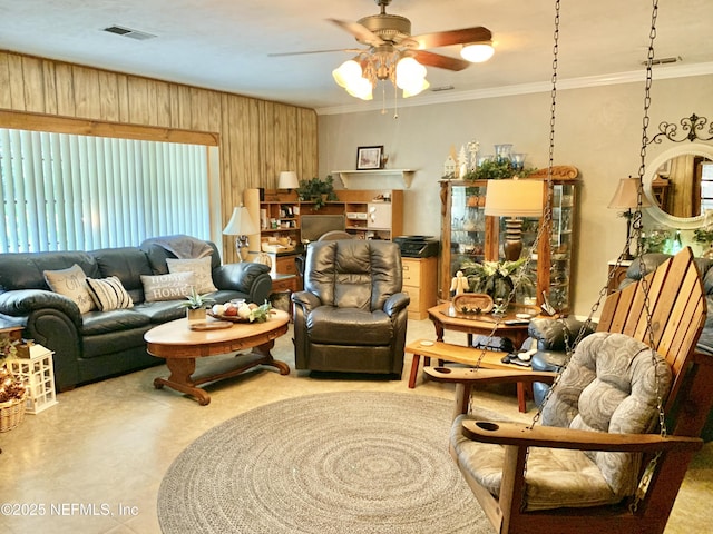 living room featuring crown molding and ceiling fan