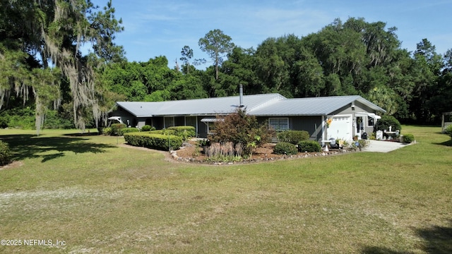 single story home with a garage and a front yard