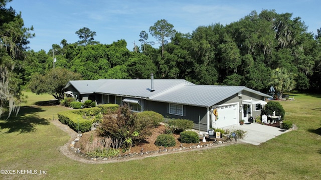 single story home with a garage and a front yard