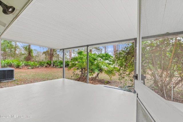 unfurnished sunroom featuring a wealth of natural light