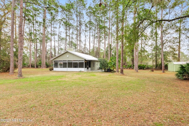 view of yard featuring a sunroom