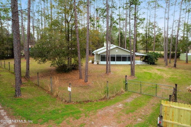 view of yard featuring a sunroom