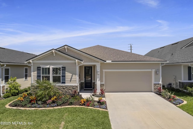 view of front of property featuring a garage and a front yard