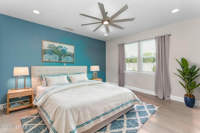 bedroom featuring ceiling fan and light hardwood / wood-style flooring