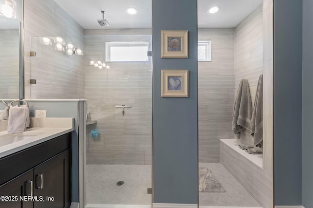 bathroom with vanity and a shower with shower door