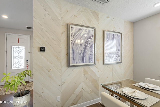 interior space featuring a textured ceiling