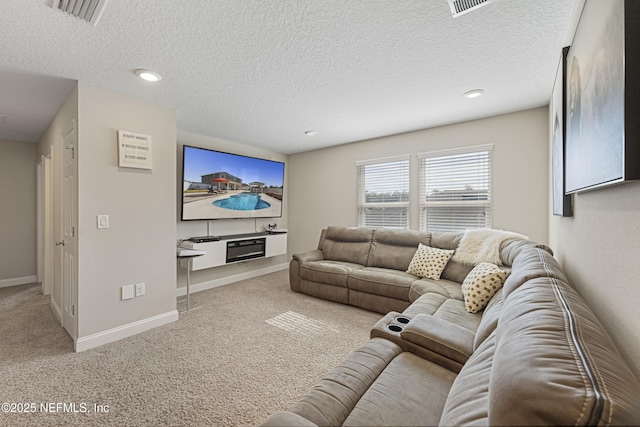 living room featuring light colored carpet and a textured ceiling