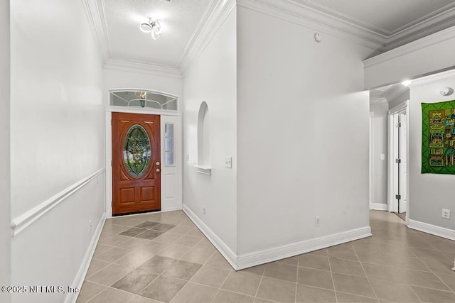 tiled entrance foyer featuring crown molding