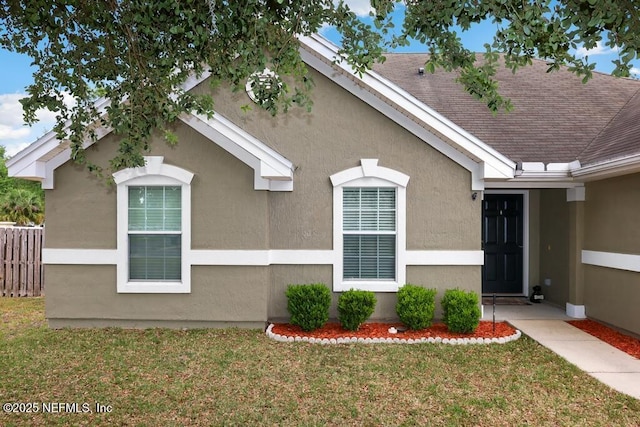 5452 Huckleberry Ct, Macclenny, FL 32063 - view of property exterior featuring stucco siding and roof with shingles