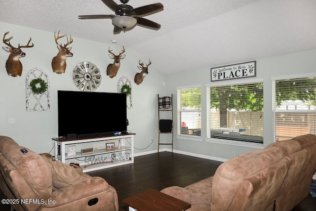 5452 Huckleberry Ct, Macclenny, FL 32063 - living room with wood finished floors, ceiling fan, baseboards, a textured ceiling, and vaulted ceiling