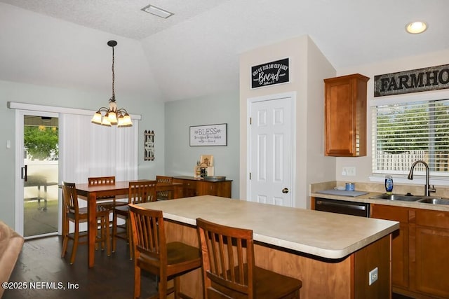 5452 Huckleberry Ct, Macclenny, FL 32063 - kitchen with a sink, healthy amount of natural light, lofted ceiling, a chandelier, and a center island
