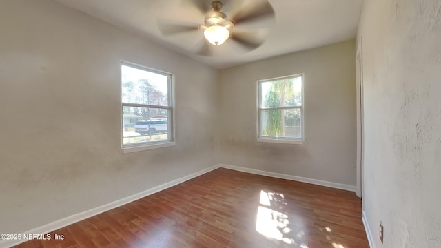 unfurnished room with wood-type flooring and ceiling fan