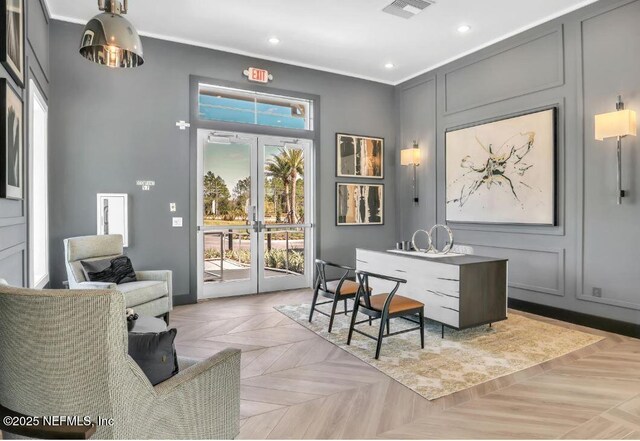 office featuring visible vents, ornamental molding, recessed lighting, french doors, and a decorative wall