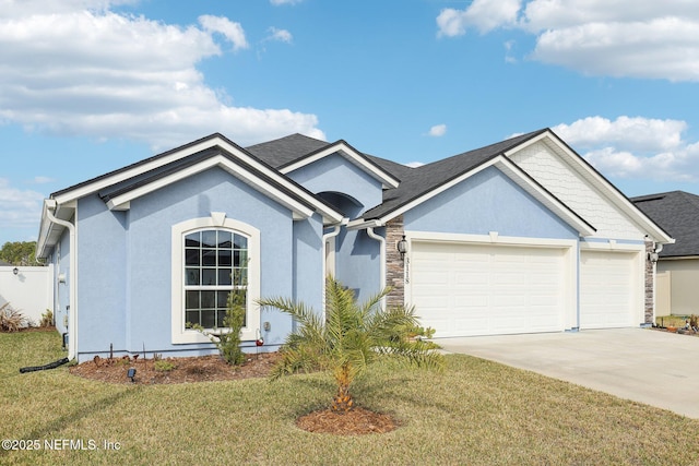 view of front of property with a garage and a front yard