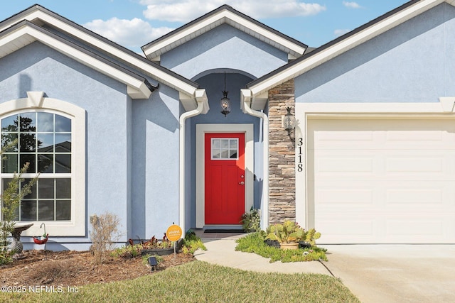 entrance to property featuring a garage