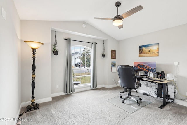 carpeted home office with ceiling fan and lofted ceiling