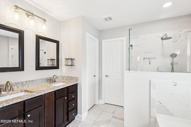 bathroom with vanity and a shower