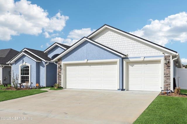 view of front of property with a garage and a front yard