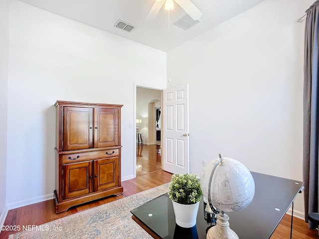 office area with hardwood / wood-style floors and ceiling fan