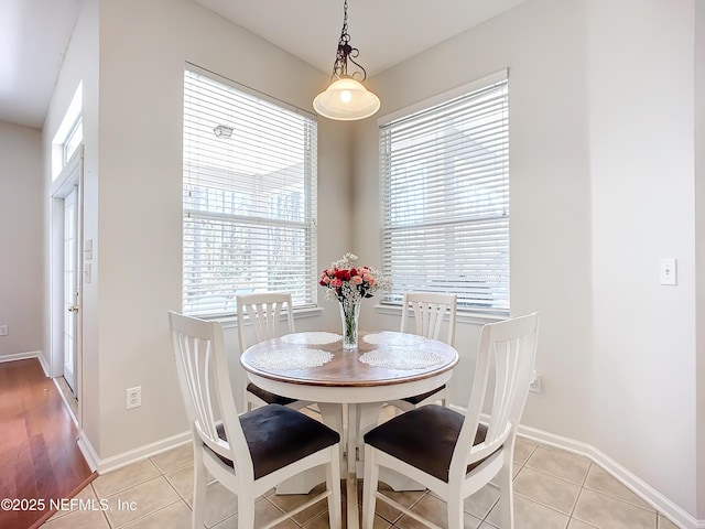 dining area featuring light tile patterned floors and a wealth of natural light