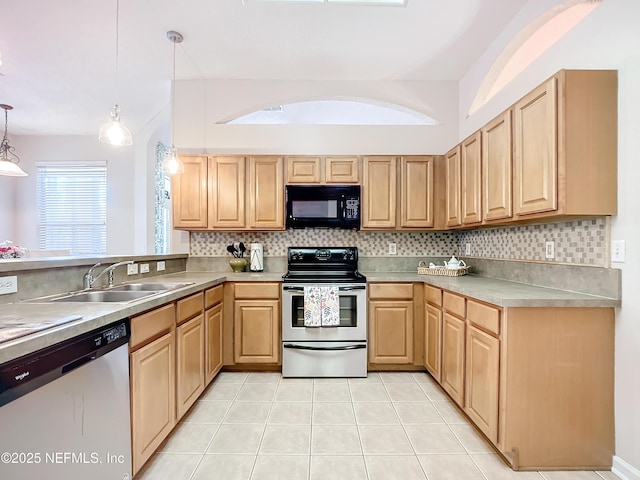 kitchen with hanging light fixtures, stainless steel appliances, sink, and light brown cabinets