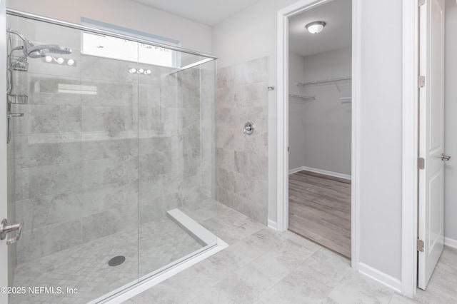 bathroom featuring a tile shower