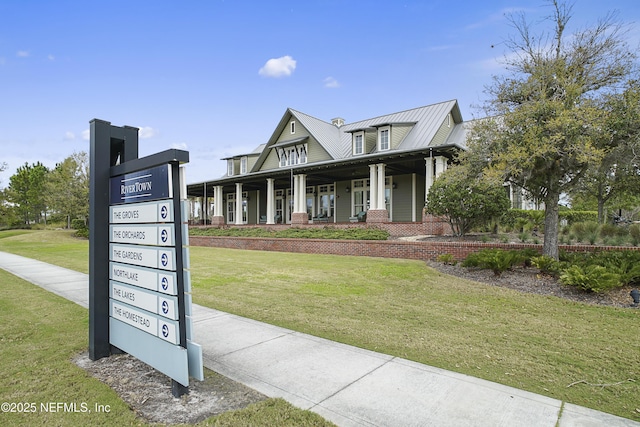 view of front facade with a porch and a front yard