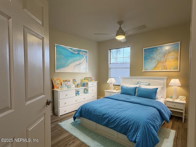 bedroom with wood-type flooring and ceiling fan