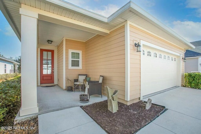 exterior space with a garage and covered porch