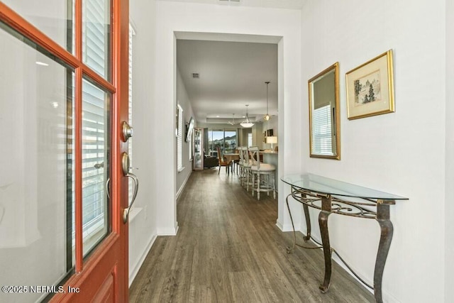 hall with wood-type flooring