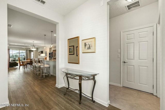 hall with wood-type flooring