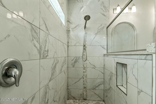 room details featuring a tile shower