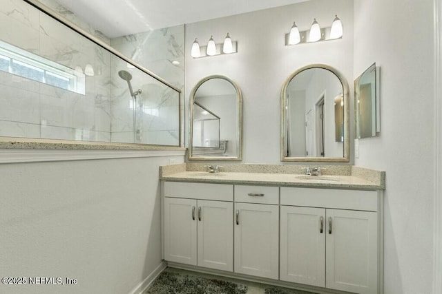 bathroom with vanity and walk in shower