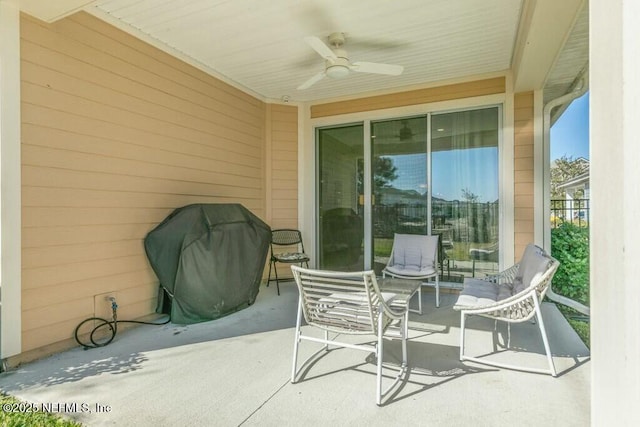 view of patio / terrace with area for grilling and ceiling fan