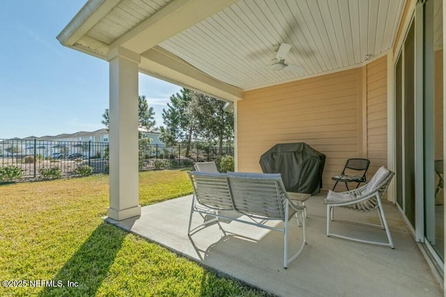 view of patio with ceiling fan and grilling area